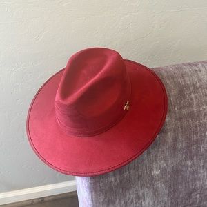 Red flat-brim fedora with eagle pin